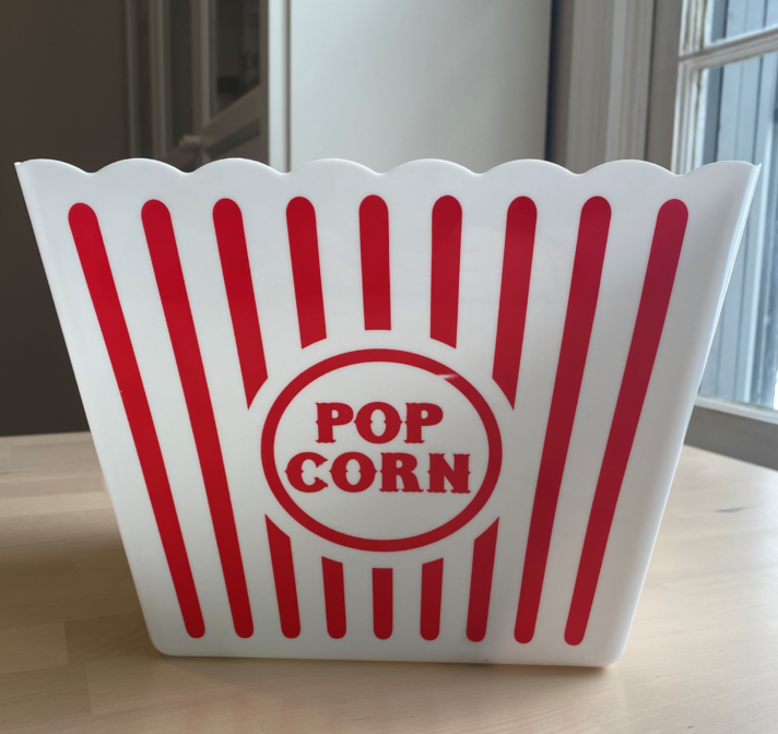 A white and red classic striped popcorn box